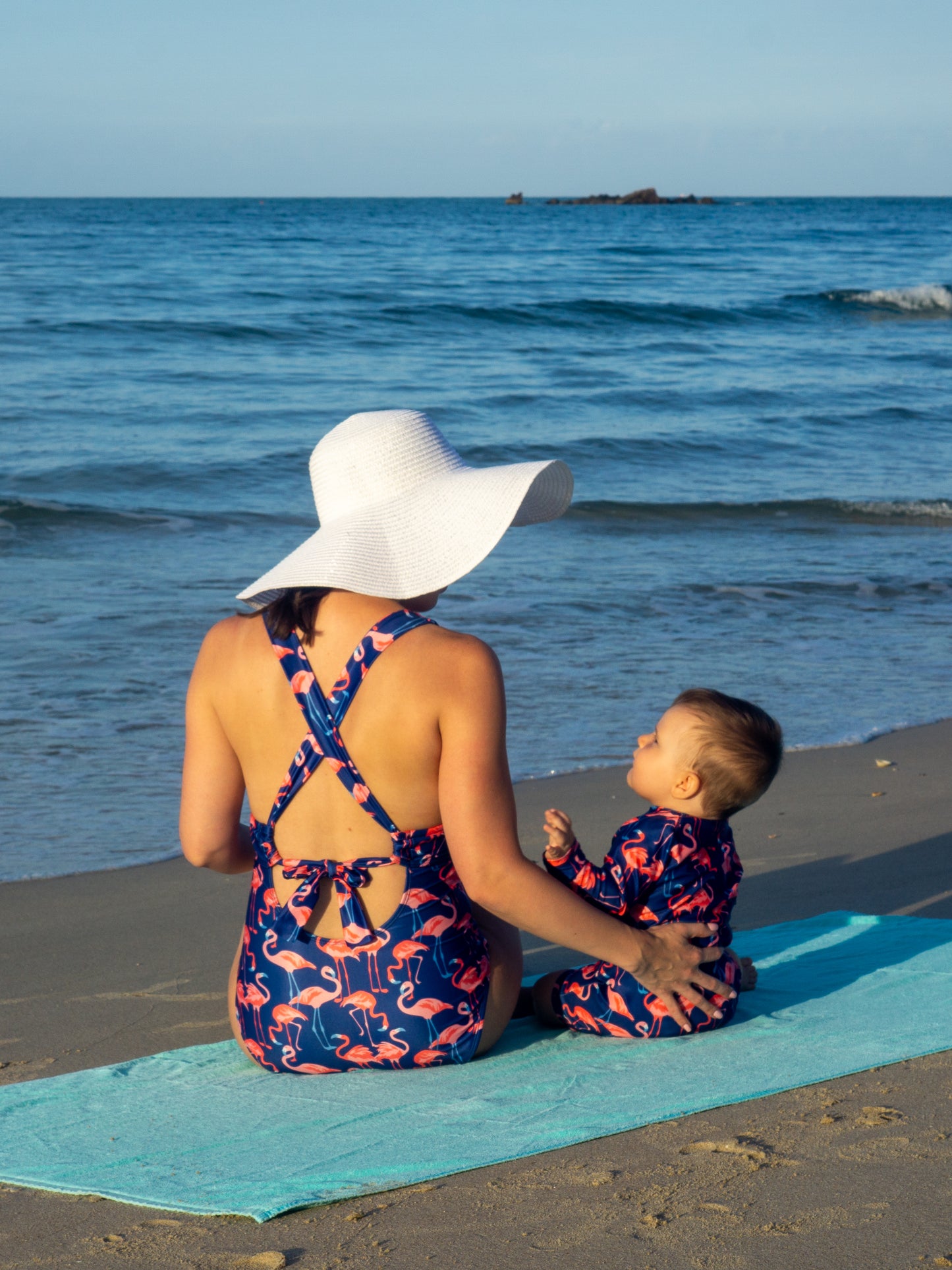 Mom and baby boy in Isla & Ray matching Flamingo print swimwear